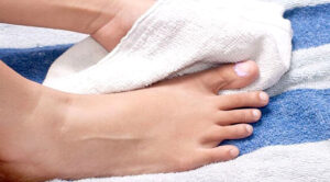 Maintaining foot hygiene with a towel for proper foot care and health at Foot & Wound Institute.